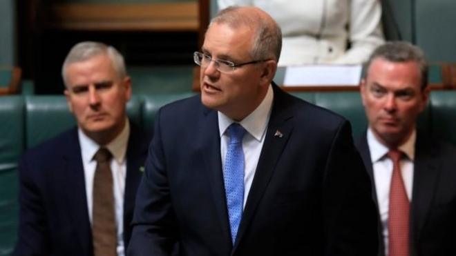 Australia PM Scott Morrison delivers the apology in parliament