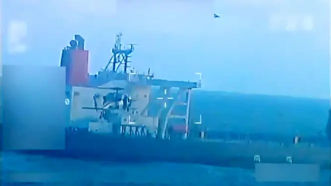The tanker is seen with a bird flying above it with a military style crosshair overlain in a grab from video