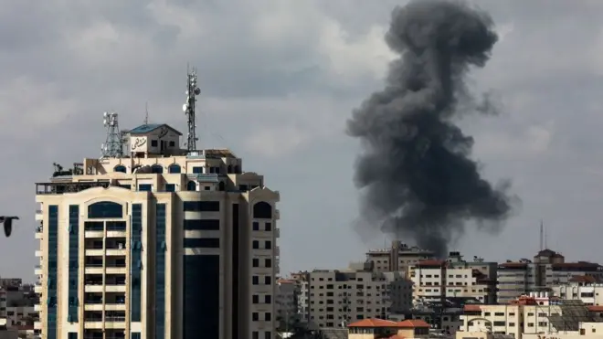 Smoke billows following an Israeli air strike on targets in Gaza City