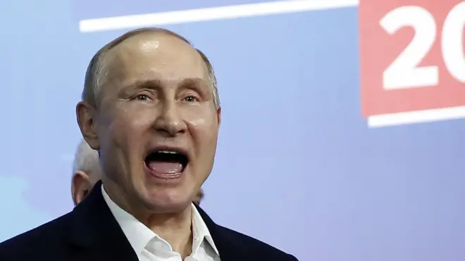 Russian President Vladimir Putin reacts as he meets with his confidants at his campaign headquarters in Moscow, Russia, 18 March 2018