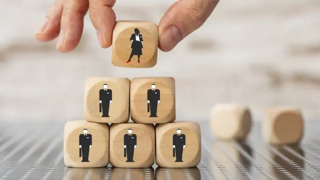 Art showing dice with male and female symbols