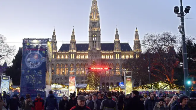 Tourists and citizens take part in New Year eve celebrations in Vienna, on December 31, 2016