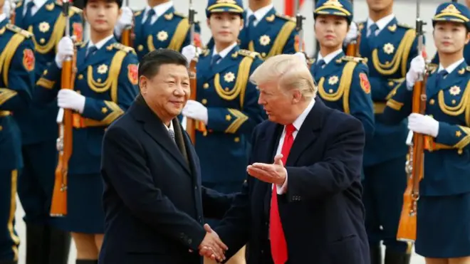 习进平和特朗普握手
