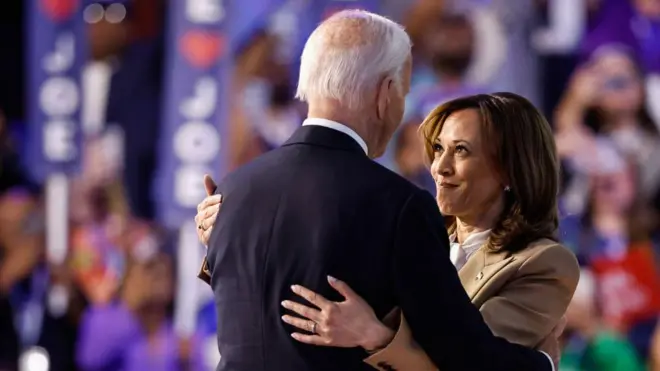 Joe Biden and Kamala Harris greet each oda
