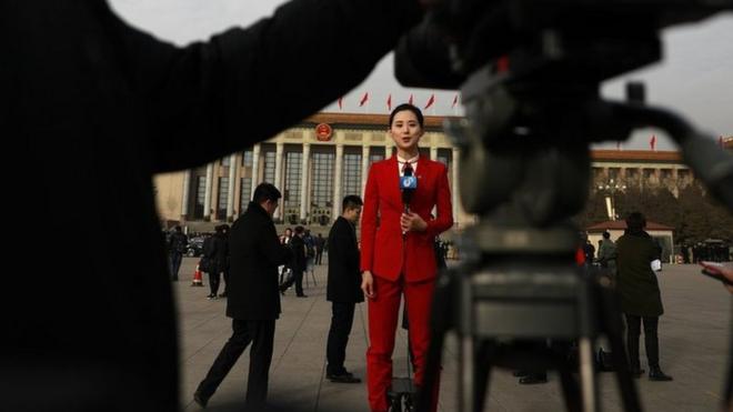 A Chinese TV journalist makes her report in Tiananmen Square during the opening of the first session of the 13th National People"s Congress (NPC) at the Great Hall of the People in Beijing, China, 05 March 2018. The NPC has over 3,000 delegates and is the world"s largest parliament or legislative assembly though its function is largely as a formal seal of approval for the policies fixed by the leaders of the Chinese Communist Party. The NPC runs alongside the annual plenary meetings of the Chinese People"s Political Consultative Conference (CPPCC), together known as "Lianghui" or "Two Meetings. EPA/HOW HWEE YOUNG EPA-EFE/HOW HWEE YOUNG