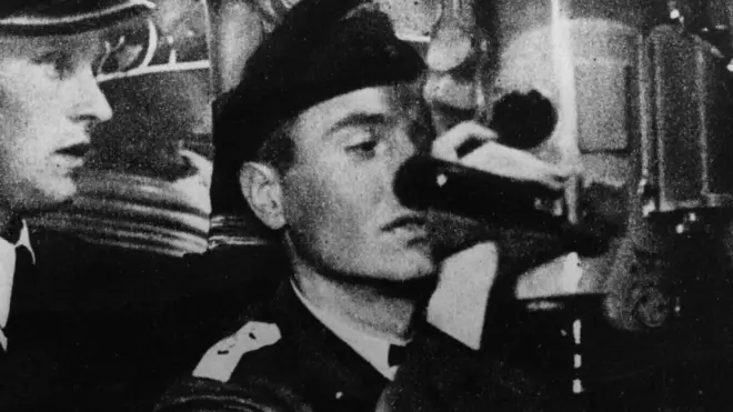 Aboard a German U-boat a seaman is learning how to use the periscope, circa 1941