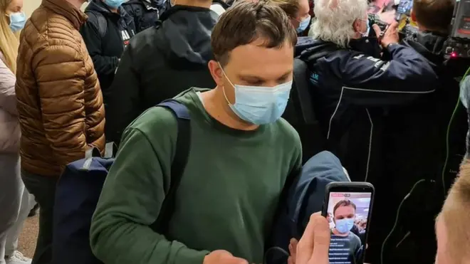 Lithuanian passenger Mantas (centre, front) said Mr Protasevich "made a mistake" giving his laptop to his girlfriend