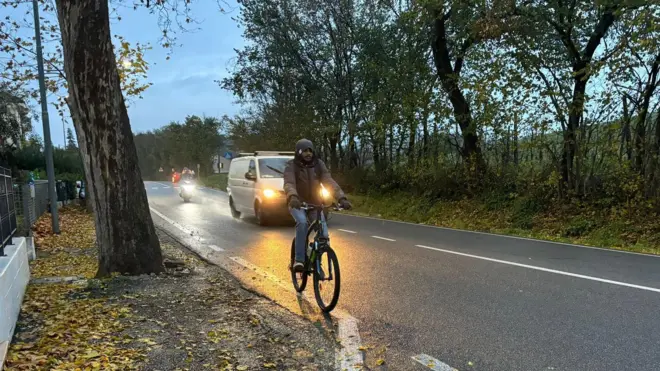 Nuwan is riding his bicycle