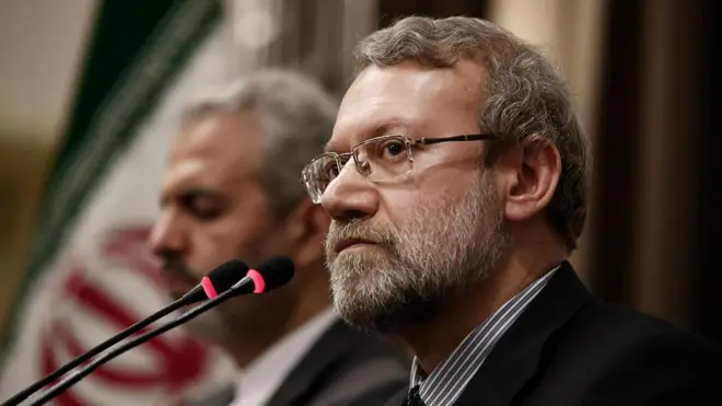 Али Лариджани в черном костюме