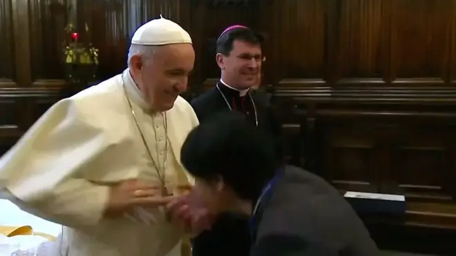 Pope greeting visitor