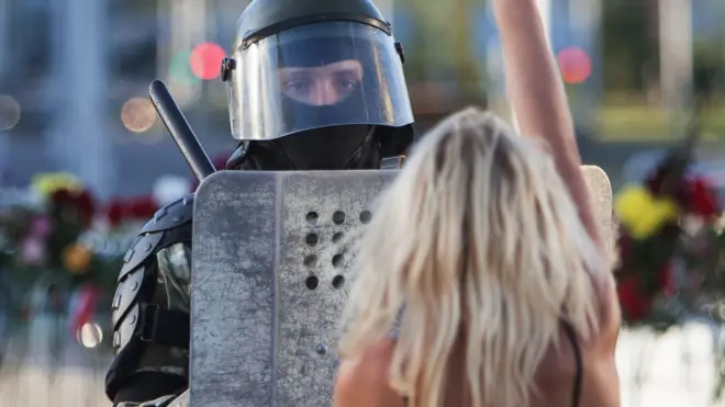 protester and police officer, 11 Aug