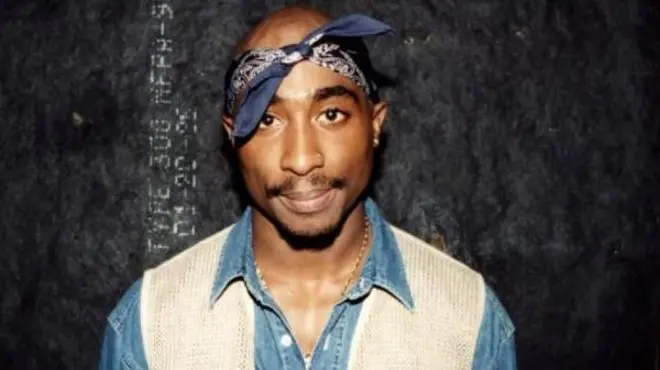 Rapper Tupac Shakur poses for photos backstage after his performance at the Regal Theater in Chicago in March 1994.