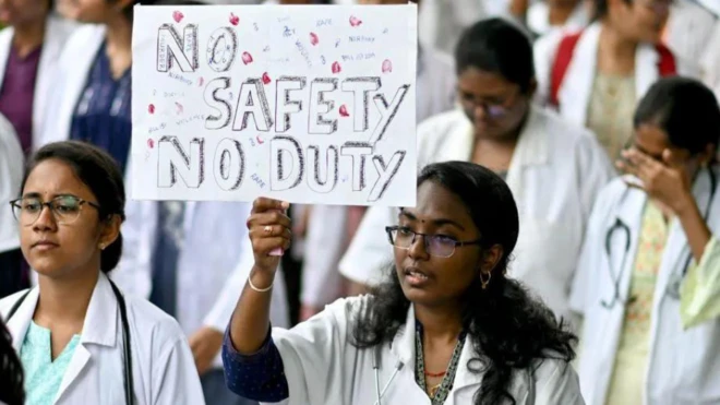 Doctor holding placard in India to protest death of dia colleague
