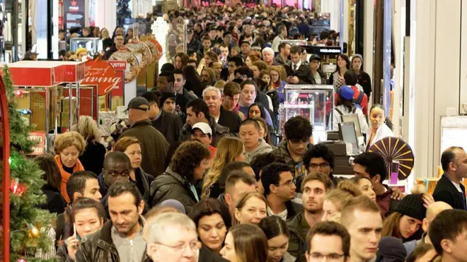 Shoppers crowd the aisles in Macys department store in Herald Square, New York, on 26 November, 2015