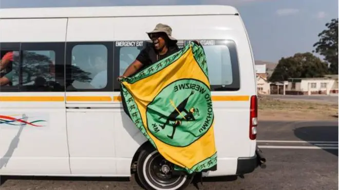 One South African dey happy as she hold one party flag