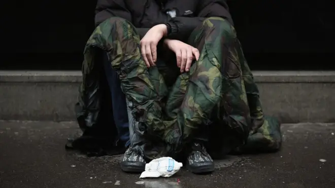 Someone asking for money near Westminster