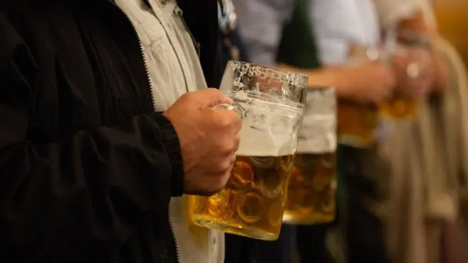 A man drinks beer at Oktoberfest