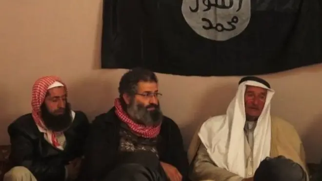 في 2014، صُور زمّار أثناء حضوره اجتماعا بين مسلحي تنظيم الدولة وزعماء قبائل سورية