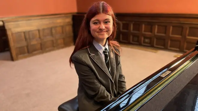 Nika playing piano in the UK