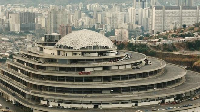 El Helicoide towering over sprawling slums in Caracas