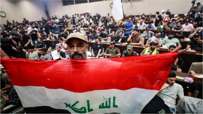 Protesters waived Iraqi flags and pictures of Sadr