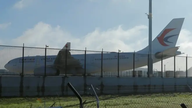 A China Eastern Airlines Airbus A330 aircraft sits on the tarmac at Sydney International Airport in Australia, June 12, 2017, after it made an emergency landing with a damaged left engine.