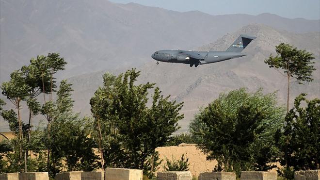 A US Air Force transport plane lands at the Bagram Air Base in Bagram on 1 July 2021