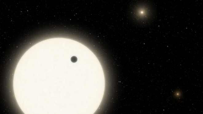 ภาพจำลองขณะดาวเคราะห์ KOI-5Ab (จุดดำ) เคลื่อนผ่านหน้าดาวฤกษ์ KOI-5A