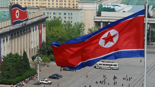 North Korean flags fly from buildings in Kim Il Sung Square in Pyongyang