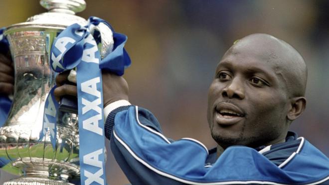20 May 2000: George Weah of Chelsea lifts the FA Cup after the final against Aston Villa at Wembley Stadium in London.
