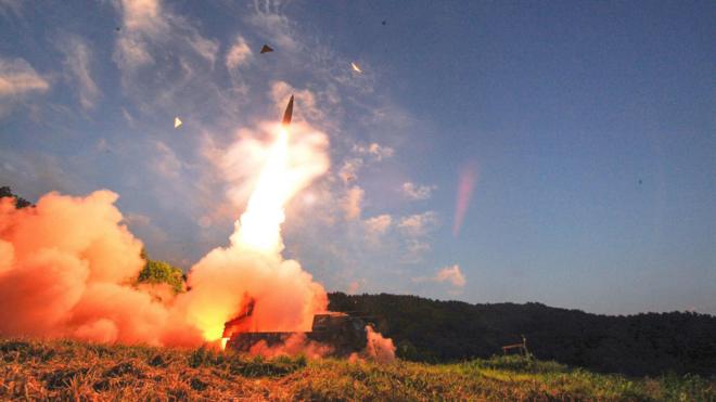 This handout photo taken on 4 September 2017 and provided by South Korean Defence Ministry in Seoul shows South Korea's missile system firing Hyunmu-2 missile into the East Sea from an undisclosed location on South Korea's east coast during a live-fire exercise simulating an attack on North Korea's nuclear site.