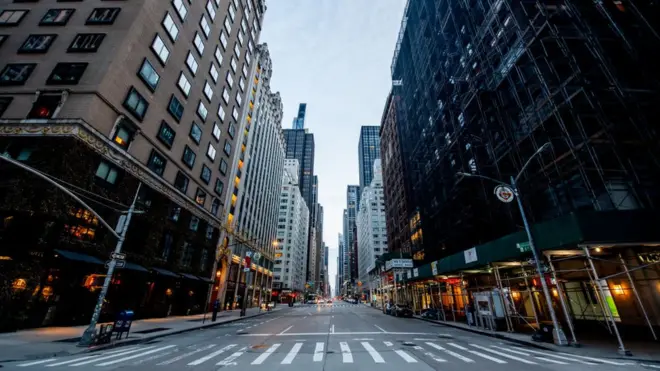 A view of 6th Avenue empty as New Yorkers practice "Social Distancing" because of the COVID-19 pandemic on 12 April, 2020 in New York City, United States