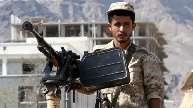 Yemeni security forces guard site where suicide car bomb exploded in Yemen's second city Aden on October 29, 2016