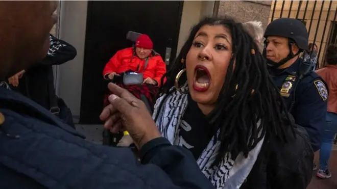 A woman shouting at a policeman