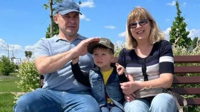 Maryna, left, and Myhailo with their grandson