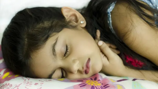 girl sleeping in bed