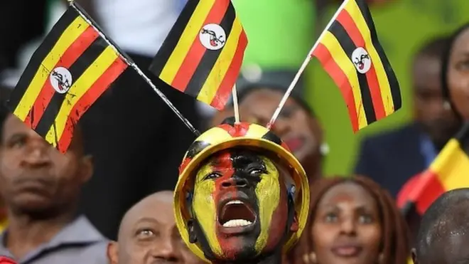 Uganda supporters cheer their team for di latest match; just as dem do for dis January 2017 match