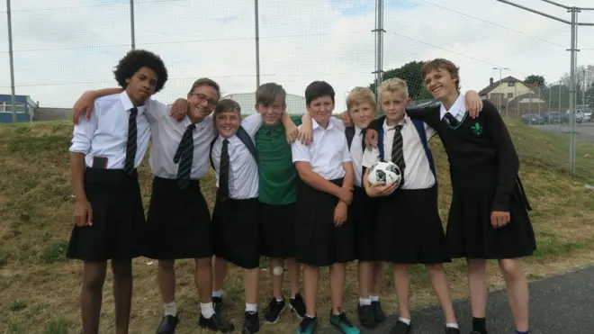 Schoolboys donned skirts in a demonstration to shed the old 'no shorts' rules