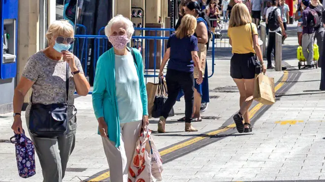 A view of Queen Street filled with shoppers