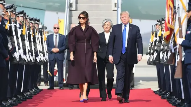 Mr Trump and his wife were welcomed by South Korea's foreign affairs minister Kang Kyung-wha (centre)