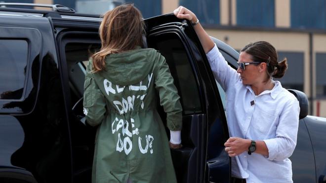 US First Lady Melania Trump walks from her to airplane to her motorcade wearing a Zara design jacket with the phrase (slogan) "I Really Don"t Care. Do U?" on the back