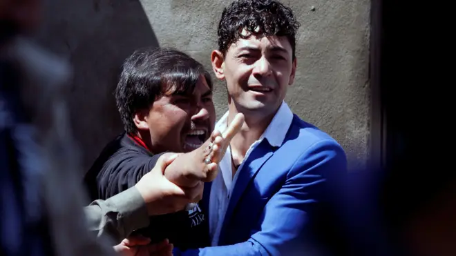 A man reacts as others comfort him at the site of a suicide attack in Kabul, Afghanistan April 22, 2018.