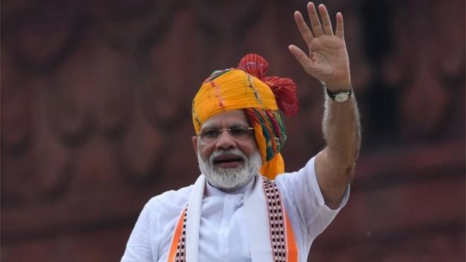 India's Prime Minister Narendra Modi waves at the crowd during a ceremony to celebrate country's 73rd Independence Day, which marks the of the end of British colonial rule, at the Red Fort in New Delhi on August 15, 2019.