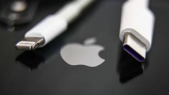 A USB Type-C charger (right) beside Apple's proprietary Lightning cable