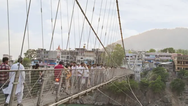 The Lakshman Jhula bridge is a popular site for tourists