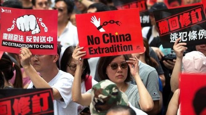 Thousands of protesters take part in a march against amendments to an extradition bill in Hong Kong, China, on 9 June 2019