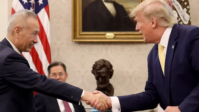 U.S. President Donald Trump shakes hands with Chinese Vice Premier Liu