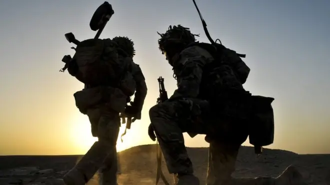 British soldiers on dawn foot patrol in Nahr-e Saraj district, Helmand Province, Afghanistan