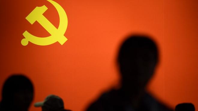 This picture taken on October 10, 2017 shows a party flag of the Chinese Communist Party displayed at an exhibition showcasing China's progress in the past five years at the Beijing Exhibition Center. China's police and censorship organs have kicked into high gear to ensure that the party's week-long, twice-a-decade congress goes smoothly when it begins on October 18. / AFP PHOTO / WANG ZHAO / TO GO WITH CHINA-POLITICS-SECURITY, FOCUS BY BECKY DAVIS (Photo credit should read WANG ZHAO/AFP/Getty Images)
