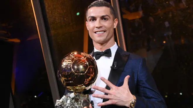 Cristiano Ronaldo with the Ballon d'Or trophy